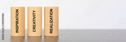 Canvas-taulu inspiration, creativity and realization written on three pillars