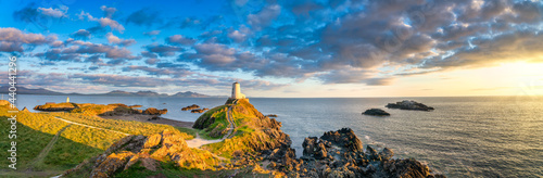 Sceninc sunset view of Lighthouse on Llanddwyn Island at the coast of Anglesey in North Wales,UK photo