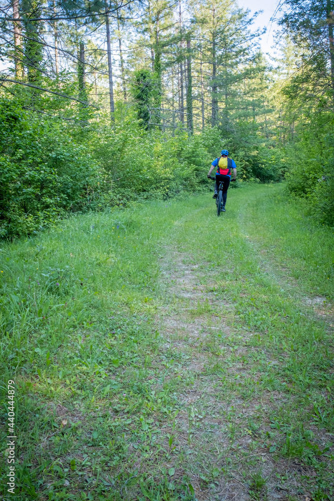 Fototapeta premium Biker running on track. Podere Montebello, Modigliana, Forlì, Emilia Romagna, Italy, Europe.
