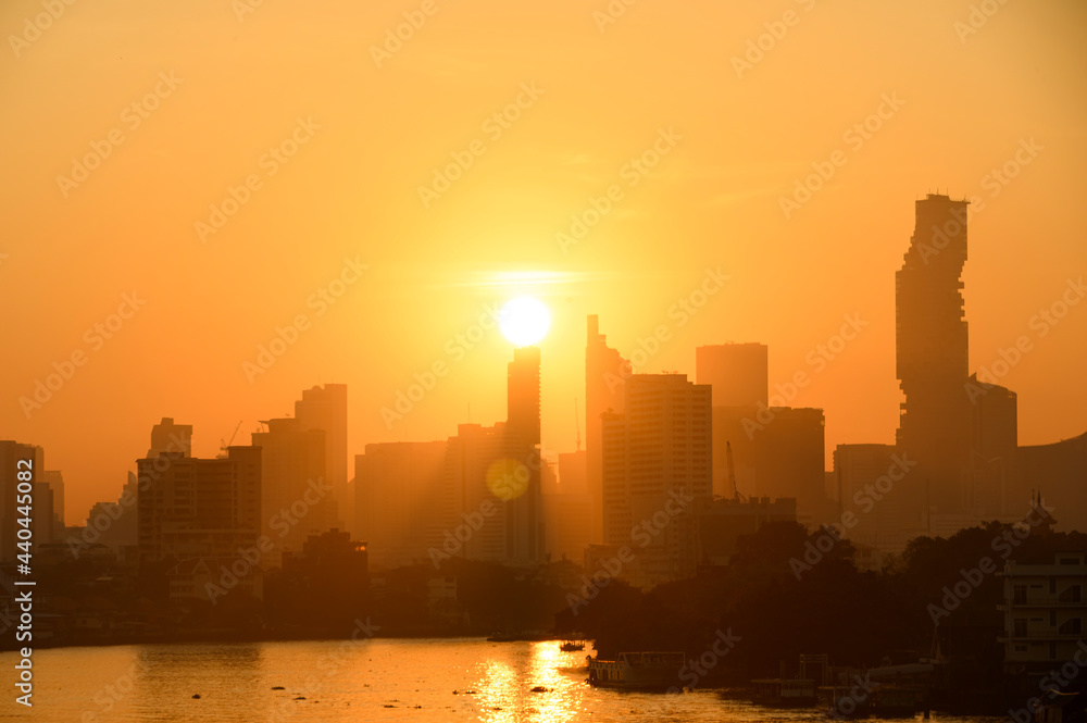 Bangkok Thailand sunrise skyline silhouette view withurban office buildings.