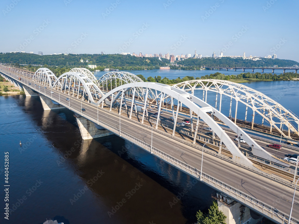 Obraz premium Darnitsky bridge in Kiev in sunny weather. Aerial drone view.