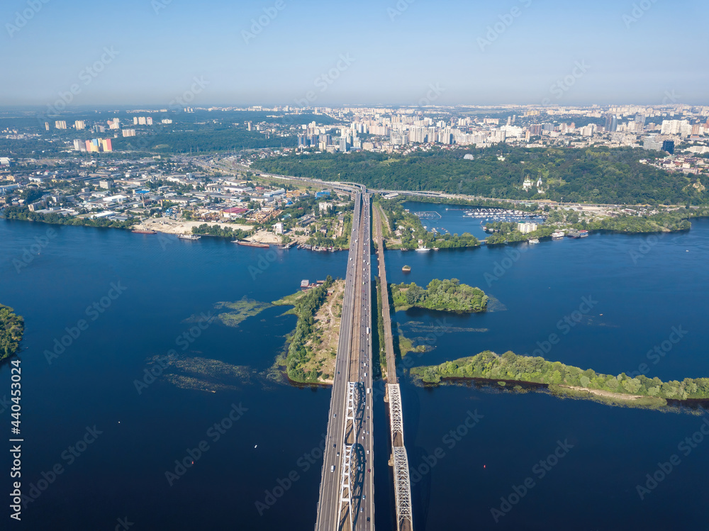 Naklejka premium Darnitsky bridge in Kiev in sunny weather. Aerial drone view.