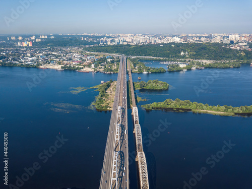 Darnitsky bridge in Kiev in sunny weather. Aerial drone view. photo