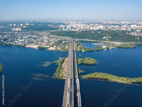 Darnitsky bridge in Kiev in sunny weather. Aerial drone view.