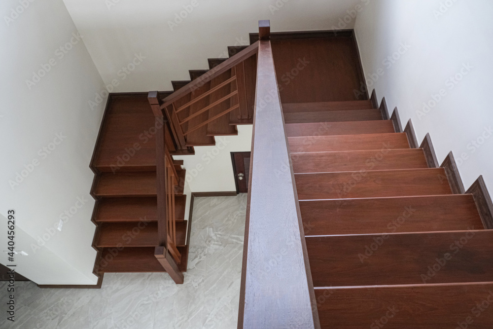 beauty wooden top viw going down stair in new house . oak color iron Handrail decor interior estate. beauty wooden top viw going down stair in new house . oak color iron Handrail decor interior estate.