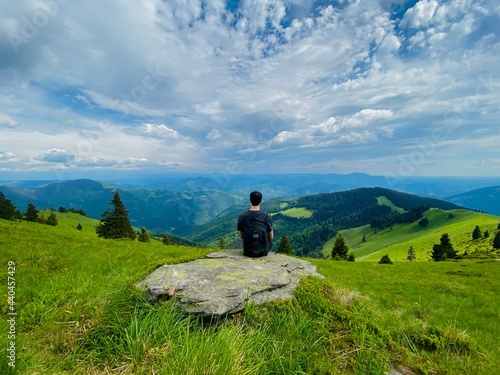 Tourist enjoying an epic view over the Carpathian Mountains in Europe, hiking is the best medicine, healthy lifestyle