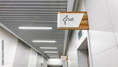 Public toilet sign for restroom. Baby changing facilities and feeding area. Men, women and disabled lavatory on blurred background photo
