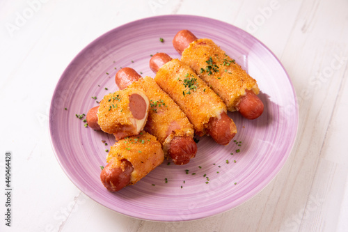 Flamenquines. Traditional Spanish tapa. Breaded sausage wrapped with ham and cheese. photo