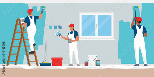Professional painters painting walls in a residential room photo