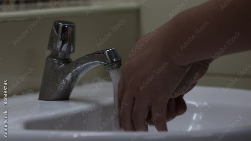 Washing hands concept. Man cleaning his hands water in bathroom, close up. Personal hygiene, health care and coronavirus prevention. Washing hands concept. Man cleaning his hands water in bathroom, close up. Personal hygiene, health care and coronavirus prevention.