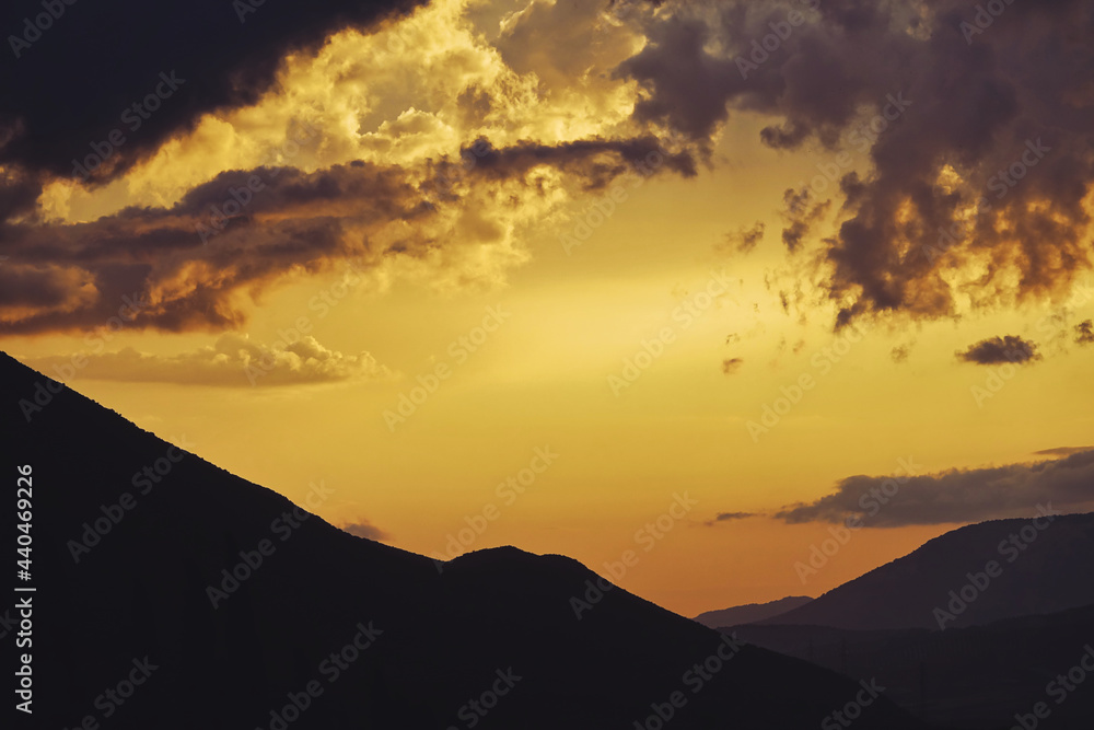 Cloudy sunset over the mountains Cloudy sunset over the mountains