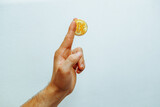Man holding bitcoin in his hand.