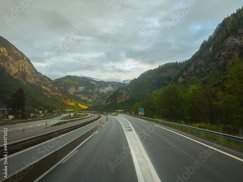 motorway with cars between mountains