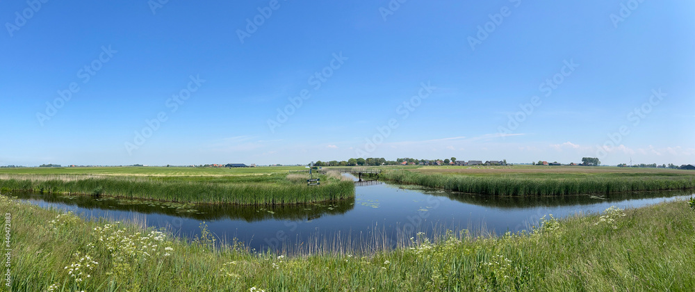 Panorama from farmland and a canal around Ferwoude