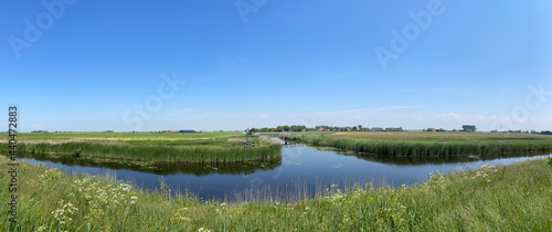 Panorama from farmland and a canal around Ferwoude