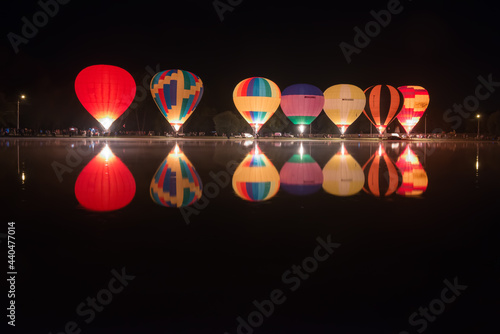 Glowing hot air balloons during the evening event of the first day of Balloon festival.
