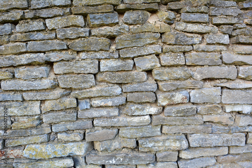 Fototapeta premium Old wall built of natural stone