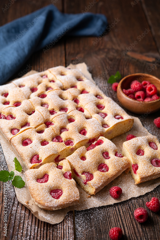 Raspberry cake known as Bublanina sprinkled with powdered sugar