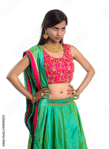 Beautiful Indian traditional girl posing on white background.