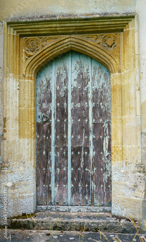 wooden doorway to the restored  1889  saxon church of a small village in Wiltshire