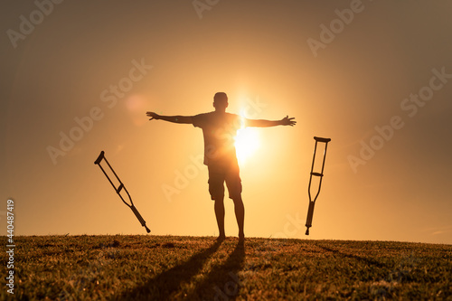 Fényképezés Healed man letting go of crutches being able to walk again