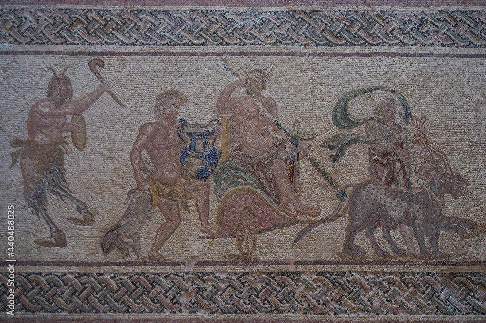 Mosaic art of Pafos Archaeological Park. The triumphal procession of Dionysus. The god of wine and ritual madness sits on a chariot drawn by panthers. Paphos, Cyprus.