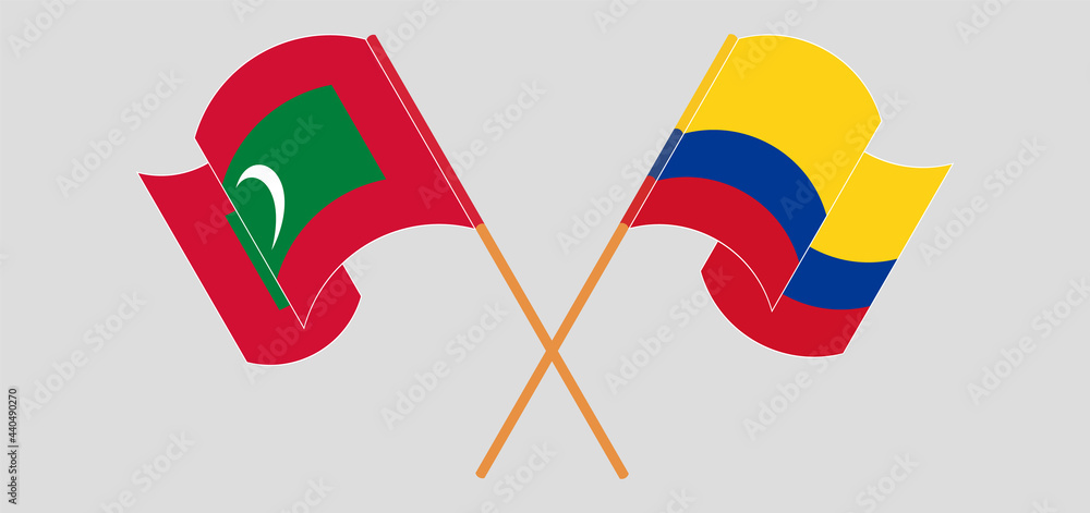 Crossed and waving flags of Maldives and Colombia Crossed and waving flags of Maldives and Colombia
