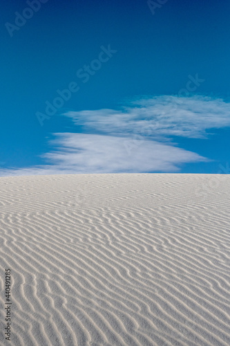 Diagonal Ripples Across White Sand Dune