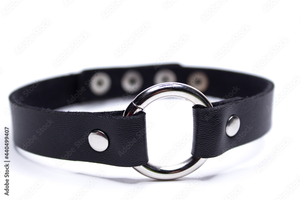 Leather choker with a circle. Decoration on the neck. Isolated on a white background. Leather choker with a circle. Decoration on the neck. Isolated on a white background.
