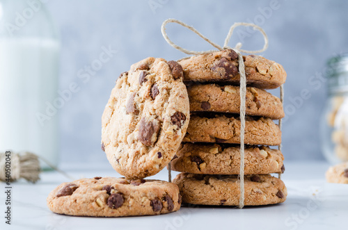 Chocolate chip cookies with milk on marble photo