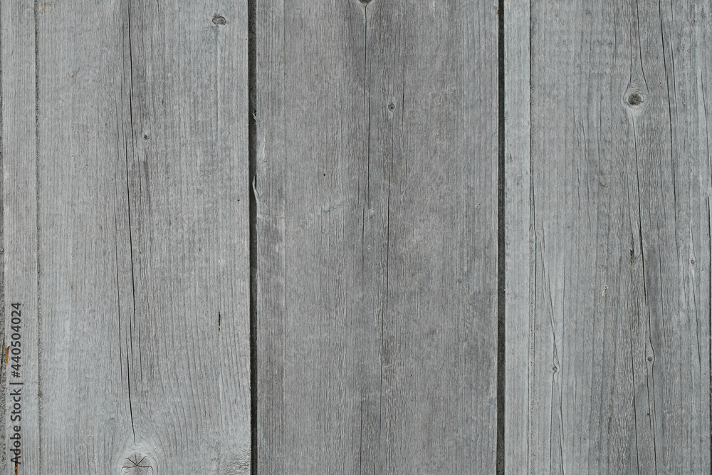 Fototapeta premium The texture of old rough wooden planks, cracked by weather and time.