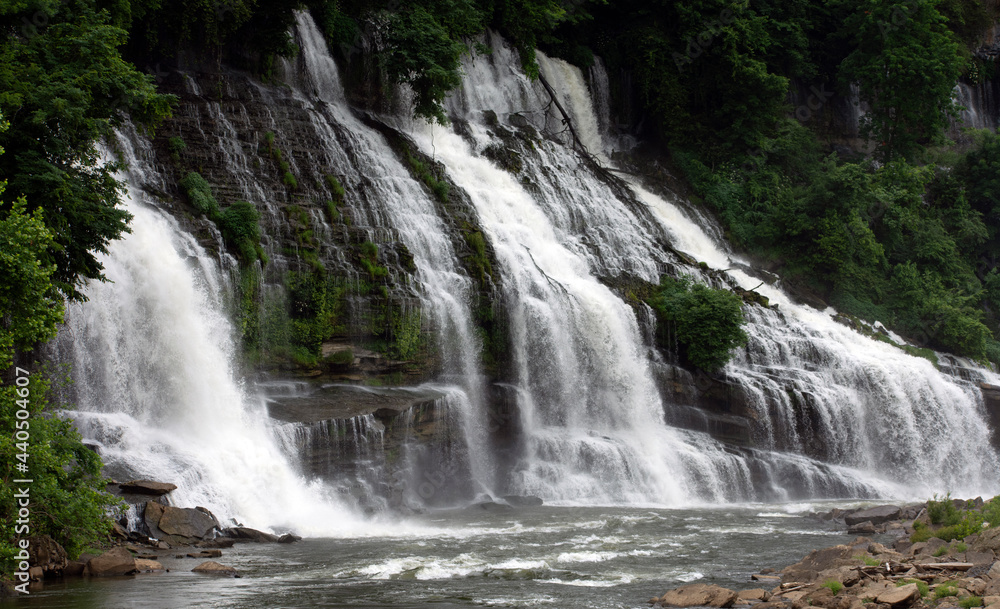 Large waterfalls cascading over rock ledges. Large waterfalls cascading over rock ledges.