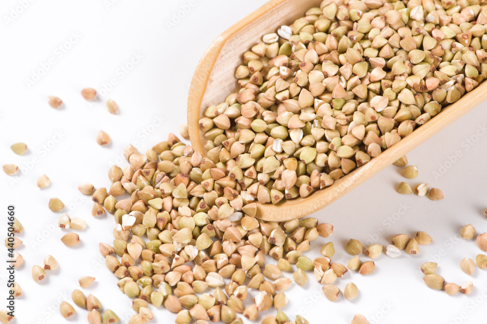 Pile of raw buckwheat isolated on white background. Pile of raw buckwheat isolated on white background.