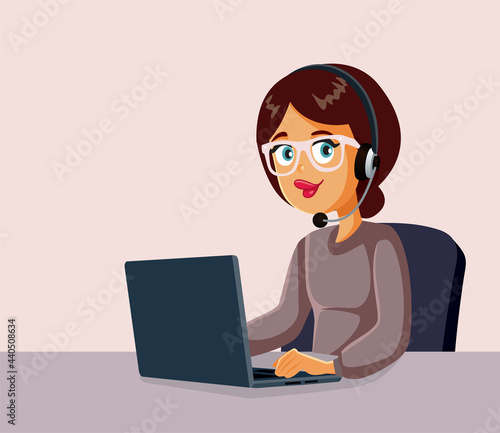 Female Call Center Operator Working on a Laptop