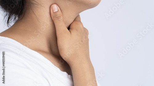 A woman has itchy neck and pain in her neck, her hands are perched. medical concept