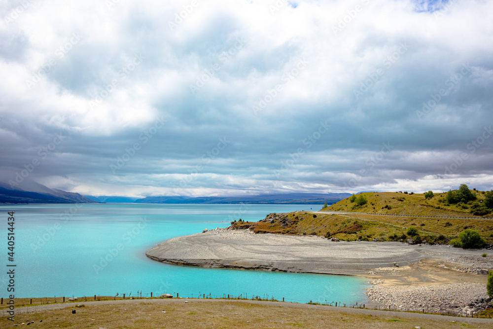 Lake Tekapo bright blue from the village shore