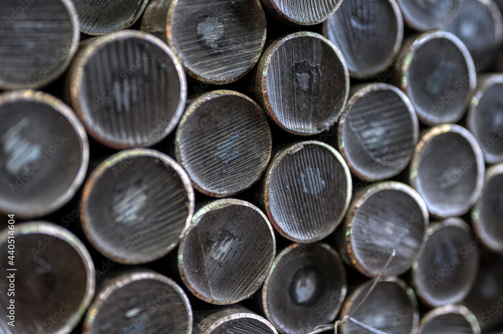 Hot rolled steel, stack of round thick metal rods close-up Hot rolled steel, stack of round thick metal rods close-up