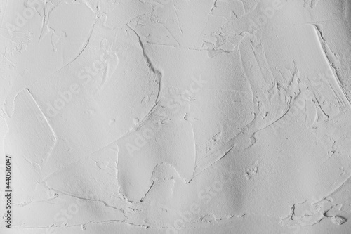 Seamless white fresco concrete wall background. Material construction texture.