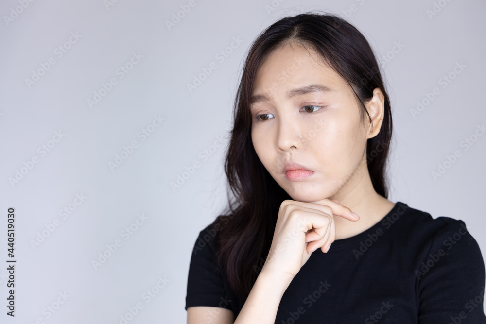 unhappy and worried young asian woman unhappy and worried young asian woman