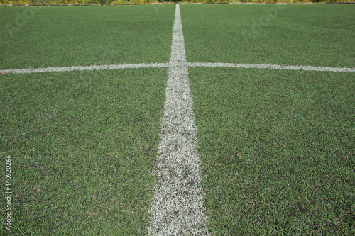 White stripe on the green soccer field