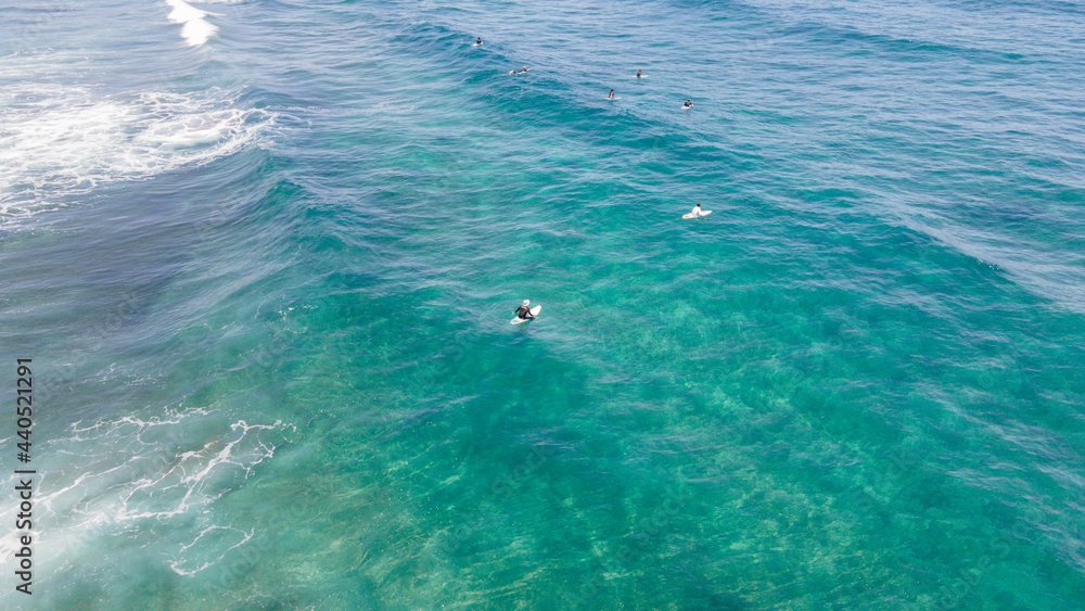 Photo with drone of the coast and surfers in the canary islands