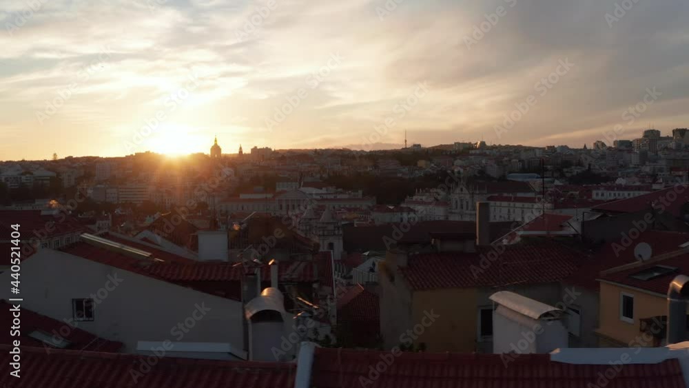 Slow aerial slider view of red rooftops with colorful old houses and churches in urban city center of Lisbon, Portugal Slow aerial slider view of red rooftops with colorful old houses and churches in urban city center of Lisbon, Portugal