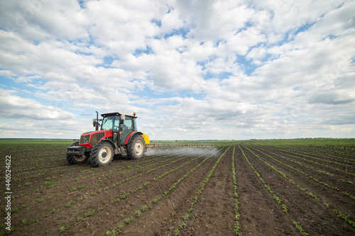 Spraying pesticides at soy bean fields