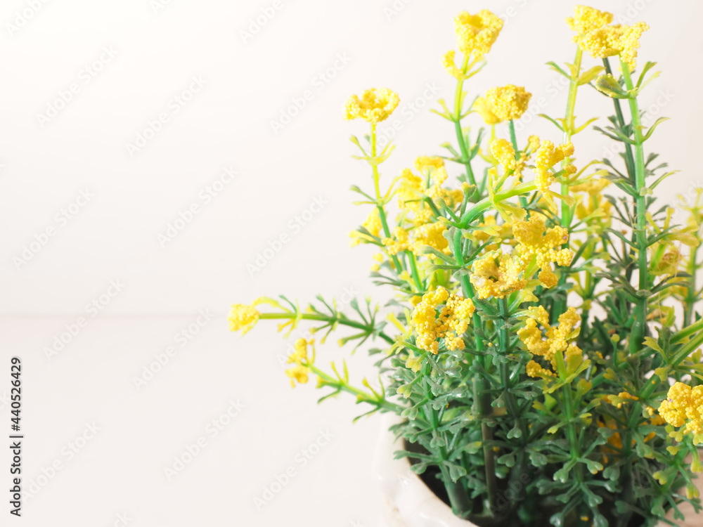 Picture of artificial plastic flower on a ceramic vase