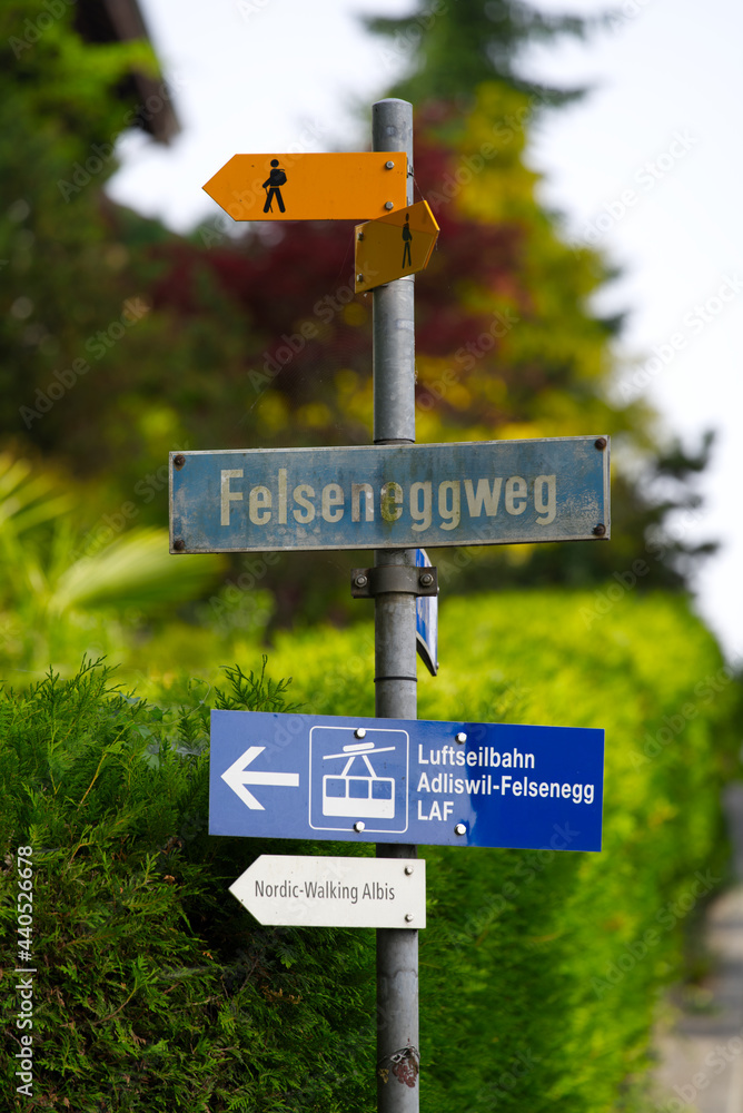 Sign post at City of Adliswil canton Zurich on a beautiful summer day morning. Photo taken June 18th, 2021, Zurich, Switzerland.