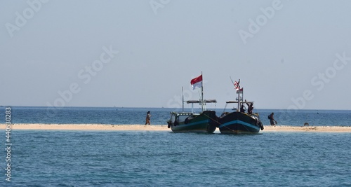 Two boats on the beach photo