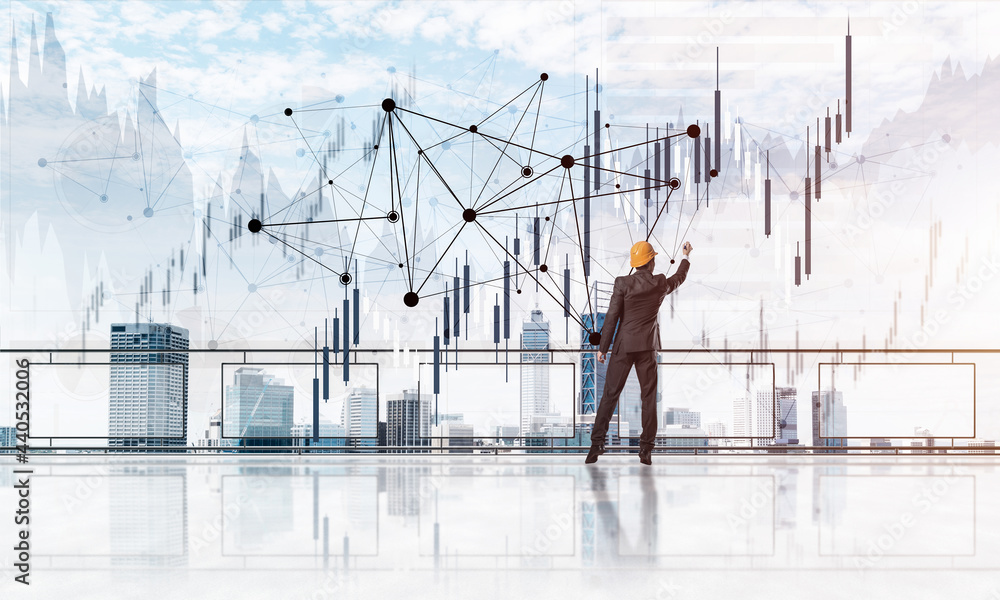 Sunrise above skyscrapers and engineer in helmet drawing globalization concept Sunrise above skyscrapers and engineer in helmet drawing globalization concept