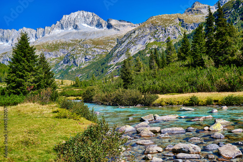 Magic montain river with summer mountains in Val di Fumo, in Adamello-Brenta ...