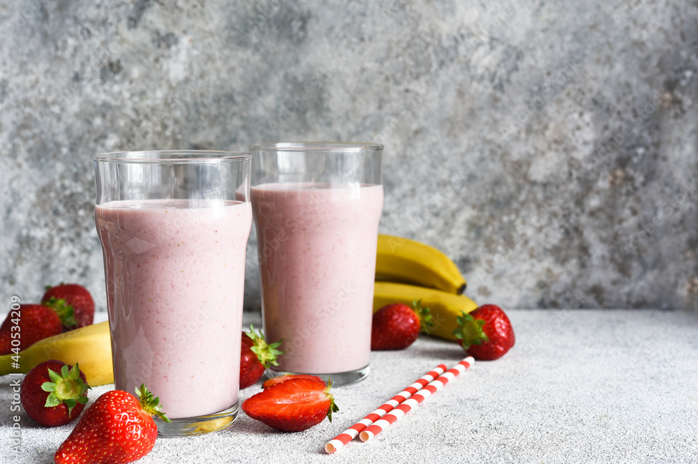 Strawberry cocktail - a milkshake with ice cream and milk. Strawberry smoothie for breakfast. Strawberry cocktail - a milkshake with ice cream and milk. Strawberry smoothie for breakfast.