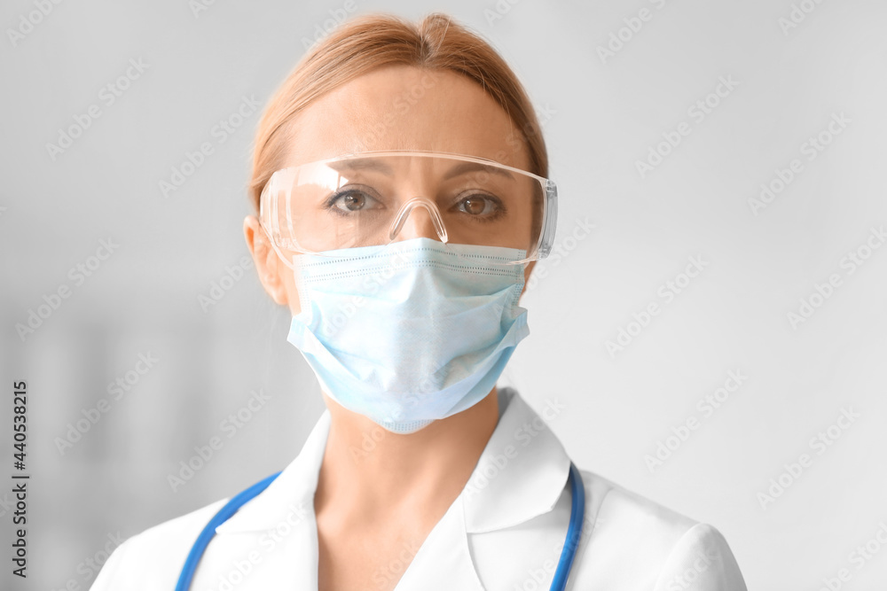 Portrait of female doctor with protective uniform in clinic Portrait of female doctor with protective uniform in clinic